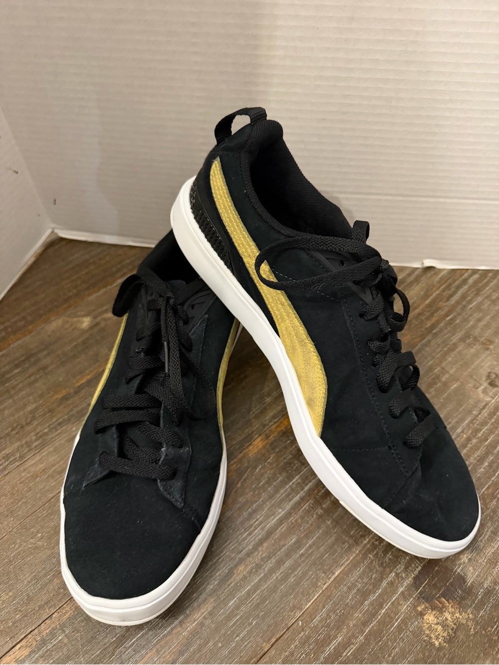Puma Black Sneakers with Gold Stripe
